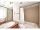 Tiled bathroom with a sink with brown cabinet, toilet, and shower-tub combo at 5122 E Shea Blvd # 1117, Scottsdale, AZ 85254