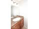 Bathroom featuring a sink with brown cabinet and granite countertop at 5122 E Shea Blvd # 1117, Scottsdale, AZ 85254