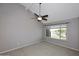 Bright bedroom with a ceiling fan and scenic window view at 5122 E Shea Blvd # 1117, Scottsdale, AZ 85254
