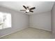 Cozy bedroom with neutral walls, carpeted floor, and modern ceiling fan at 5122 E Shea Blvd # 1117, Scottsdale, AZ 85254