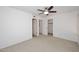 Spacious bedroom featuring a ceiling fan and multiple closets at 5122 E Shea Blvd # 1117, Scottsdale, AZ 85254