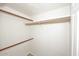 Walk-in closet with ample storage space and wooden rods at 5122 E Shea Blvd # 1117, Scottsdale, AZ 85254