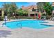 Spacious community pool with bright blue water, accessible entrances, and poolside seating at 5122 E Shea Blvd # 1117, Scottsdale, AZ 85254