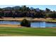 Golf course community with lake, mature trees, and mountain views at 5122 E Shea Blvd # 1117, Scottsdale, AZ 85254