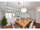 Cozy dining area with hardwood floors, seating for six, and a modern chandelier for stylish meals at 5122 E Shea Blvd # 1117, Scottsdale, AZ 85254