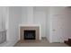 Living room featuring a fireplace, carpet, and natural light from the window at 5122 E Shea Blvd # 1117, Scottsdale, AZ 85254