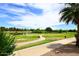 Scenic golf course view with lush green fairways, a tranquil lake, and clear blue skies at 5122 E Shea Blvd # 1117, Scottsdale, AZ 85254