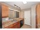 Traditional kitchen featuring wood cabinets, granite countertops, and stainless steel appliances at 5122 E Shea Blvd # 1117, Scottsdale, AZ 85254