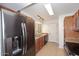 A kitchen with stainless steel appliances and brown cabinets at 5122 E Shea Blvd # 1117, Scottsdale, AZ 85254