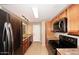 Modern kitchen with stainless steel appliances and wood cabinets at 5122 E Shea Blvd # 1117, Scottsdale, AZ 85254