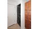 Laundry room with stackable washer/dryer, shelving and storage cabinet at 5122 E Shea Blvd # 1117, Scottsdale, AZ 85254