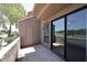 Outdoor patio with a door leading to a storage closet and sliding glass doors to interior space at 5122 E Shea Blvd # 1117, Scottsdale, AZ 85254