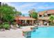 Poolside bar with seating and stone pillars; a wonderful place to relax and enjoy the community at 5122 E Shea Blvd # 1117, Scottsdale, AZ 85254