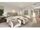 The bright and airy main bedroom features hardwood floors, a sitting area, neutral decor, and modern lighting at 5630 E Rockridge Rd, Phoenix, AZ 85018