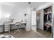 Bright bedroom with twin bed, desk, and large closet with sliding doors at 5835 E Dodge St, Mesa, AZ 85205