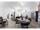 Elegant dining area with a glass-top table and modern chandelier at 5835 E Dodge St, Mesa, AZ 85205