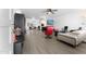 Open concept living area with hardwood floors and a view into the dining area at 5835 E Dodge St, Mesa, AZ 85205
