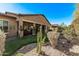 Spacious backyard with covered patio, artificial turf, and a water fountain at 9814 W Rowel Rd, Peoria, AZ 85383