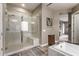 Spa-like bathroom with walk-in shower and soaking tub at 9814 W Rowel Rd, Peoria, AZ 85383