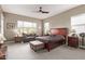 Spacious bedroom with king-size bed and sitting area at 9814 W Rowel Rd, Peoria, AZ 85383
