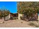 Single story home with desert landscaping and a two-car garage at 9814 W Rowel Rd, Peoria, AZ 85383