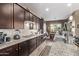 Well-equipped kitchen featuring stainless steel appliances and ample cabinetry at 9814 W Rowel Rd, Peoria, AZ 85383