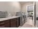 Convenient laundry room with washer, dryer, and extra counter space at 9814 W Rowel Rd, Peoria, AZ 85383
