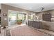 Living area with sliding glass doors leading to a patio and a built-in entertainment center at 9814 W Rowel Rd, Peoria, AZ 85383