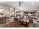 Open concept living area showcasing a large sectional sofa and kitchen views at 9814 W Rowel Rd, Peoria, AZ 85383