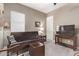Bright office with a futon, side table, and ample natural light at 9814 W Rowel Rd, Peoria, AZ 85383