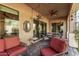 Relaxing covered patio with seating area, perfect for outdoor dining and entertaining at 9814 W Rowel Rd, Peoria, AZ 85383