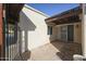 Inviting front patio with brick flooring and gated entry at 153 Laguna W Dr, Litchfield Park, AZ 85340