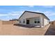 The backyard has a covered patio, a block wall and is ready for landscaping at 16590 N Dante Way, Maricopa, AZ 85138