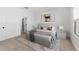 Bright bedroom with a comfortable queen-size bed, stylish decor, and neutral colors at 16590 N Dante Way, Maricopa, AZ 85138