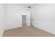 Empty bedroom with neutral carpet, closet, and simple decor at 16590 N Dante Way, Maricopa, AZ 85138
