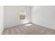 Empty bedroom with neutral carpet and bright natural light at 16590 N Dante Way, Maricopa, AZ 85138