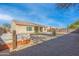 Spacious backyard with covered hot tub, gravel, and a partially covered patio at 4219 N 161St Ave, Goodyear, AZ 85395