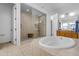 Spa-like bathroom with soaking tub and walk-in shower at 4219 N 161St Ave, Goodyear, AZ 85395