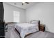 Bedroom with queen bed, desk, and window coverings at 4219 N 161St Ave, Goodyear, AZ 85395