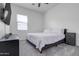 Cozy bedroom with a queen bed and window coverings at 4219 N 161St Ave, Goodyear, AZ 85395