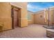 Private courtyard with brick pavers and an outdoor umbrella at 4219 N 161St Ave, Goodyear, AZ 85395