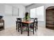 Small dining area with a wooden table and four chairs at 4219 N 161St Ave, Goodyear, AZ 85395