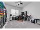 Home office with a desk, electronic drum set and ample natural light at 4219 N 161St Ave, Goodyear, AZ 85395
