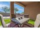 Covered patio with seating area and view of backyard at 4219 N 161St Ave, Goodyear, AZ 85395