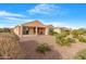 Spacious backyard with gravel landscaping and covered patio at 4435 N Presidio Dr, Florence, AZ 85132