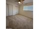 Bright bedroom offering ample closet space, soft carpeting, and a cozy ambiance at 4643 W Laurel Ln, Glendale, AZ 85304