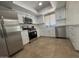 Well-lit kitchen with stainless steel appliances, white cabinets, and subway tile backsplash at 4643 W Laurel Ln, Glendale, AZ 85304