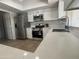Bright kitchen featuring stainless steel appliances, quartz countertops, and ample cabinet space at 4643 W Laurel Ln, Glendale, AZ 85304