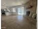 Spacious living room with stone fireplace and a view of the pool through sliding glass doors at 4643 W Laurel Ln, Glendale, AZ 85304