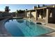Sparkling backyard pool with an outdoor covered patio and scenic landscaping at 4643 W Laurel Ln, Glendale, AZ 85304